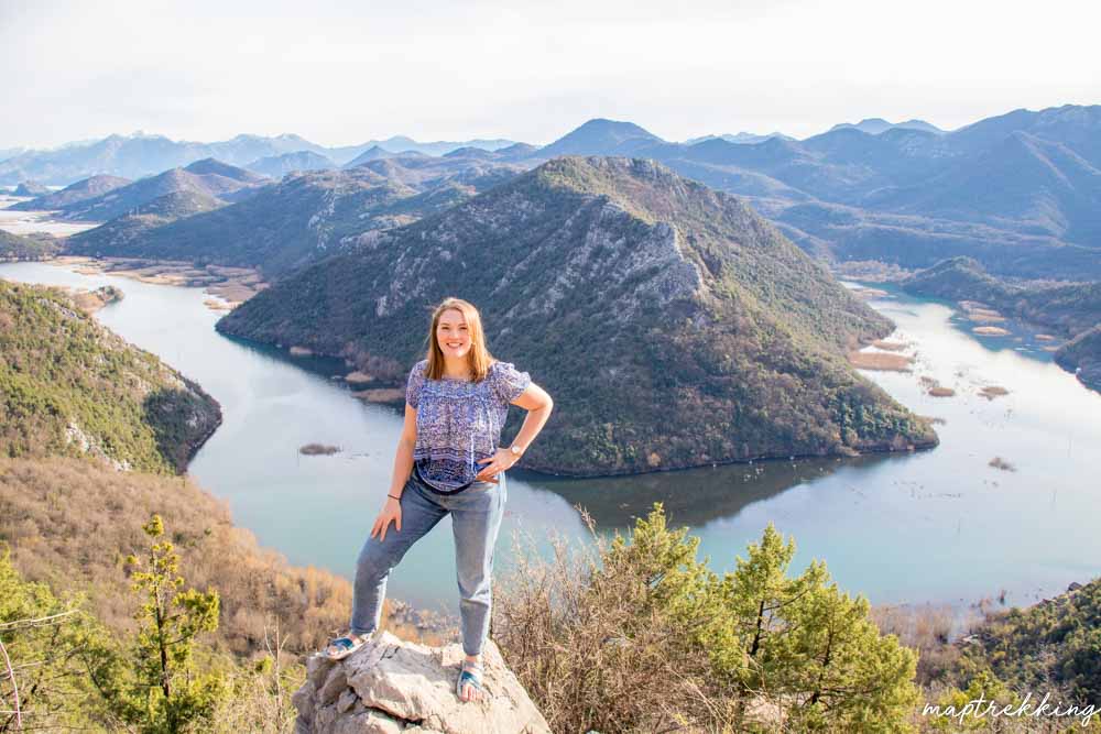 a beautiful girl standing in front of river bend coming from Lake Skadar in Montenegro that you will often see while living in Montenegro